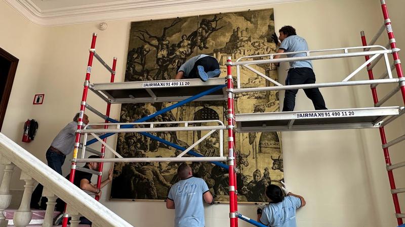A painting by Catalan muralist Josep Maria Sert being installed at the US Consulate in Barcelona after being moved from Madrid