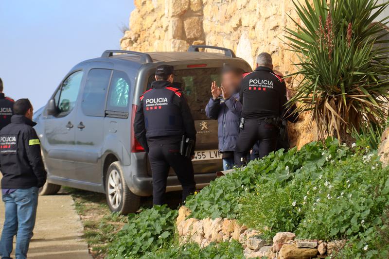 The alleged killer during the inspection of his home in La Morera de Montsant, southern Catalonia.