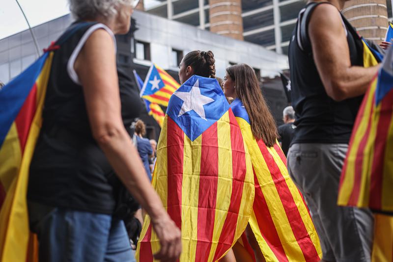 Independence supporters with estelada flags attend a demonstration in Barcelona on Catalonia's National Day 2022