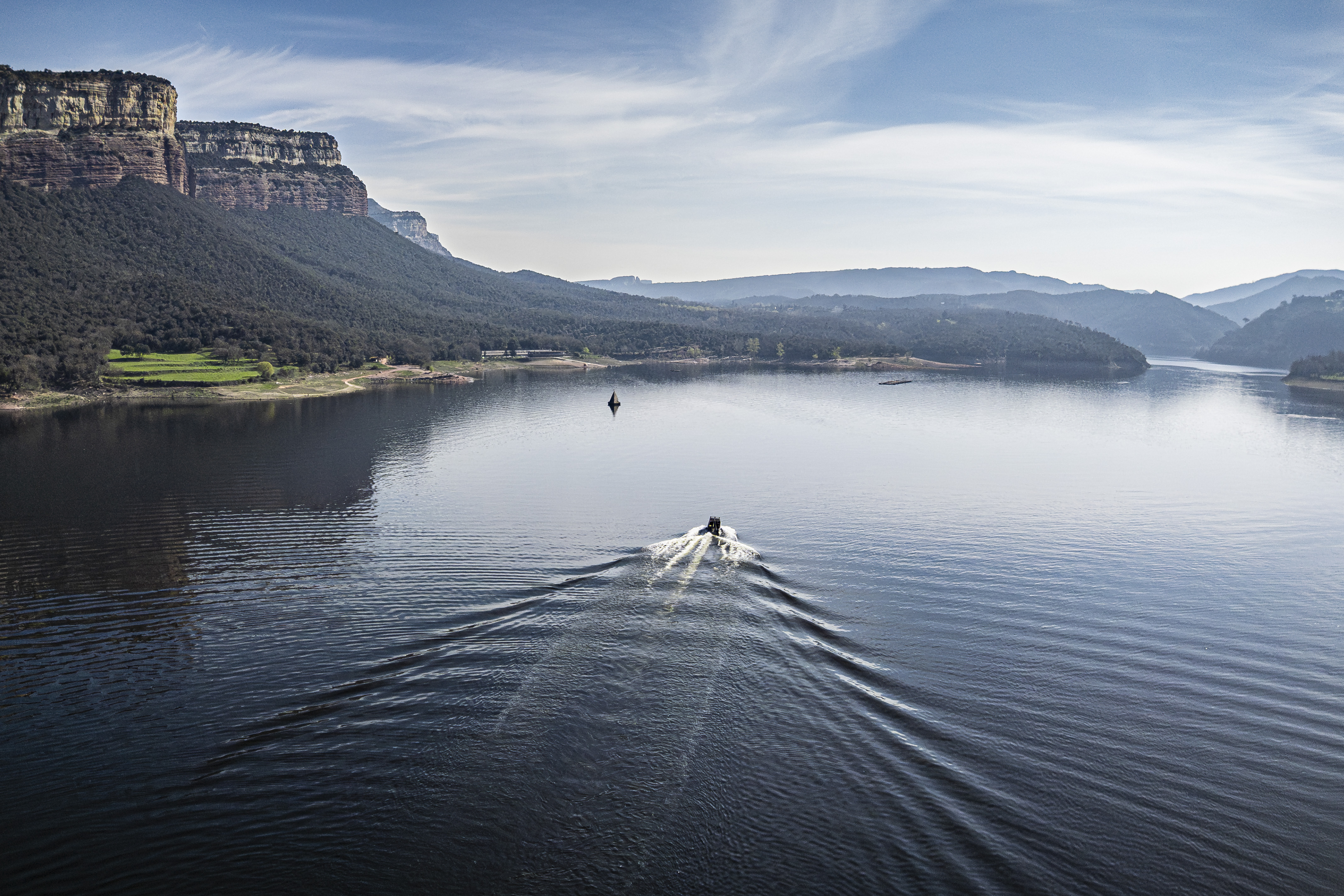 A boat sails on the Sau reservoir at 72% capacity