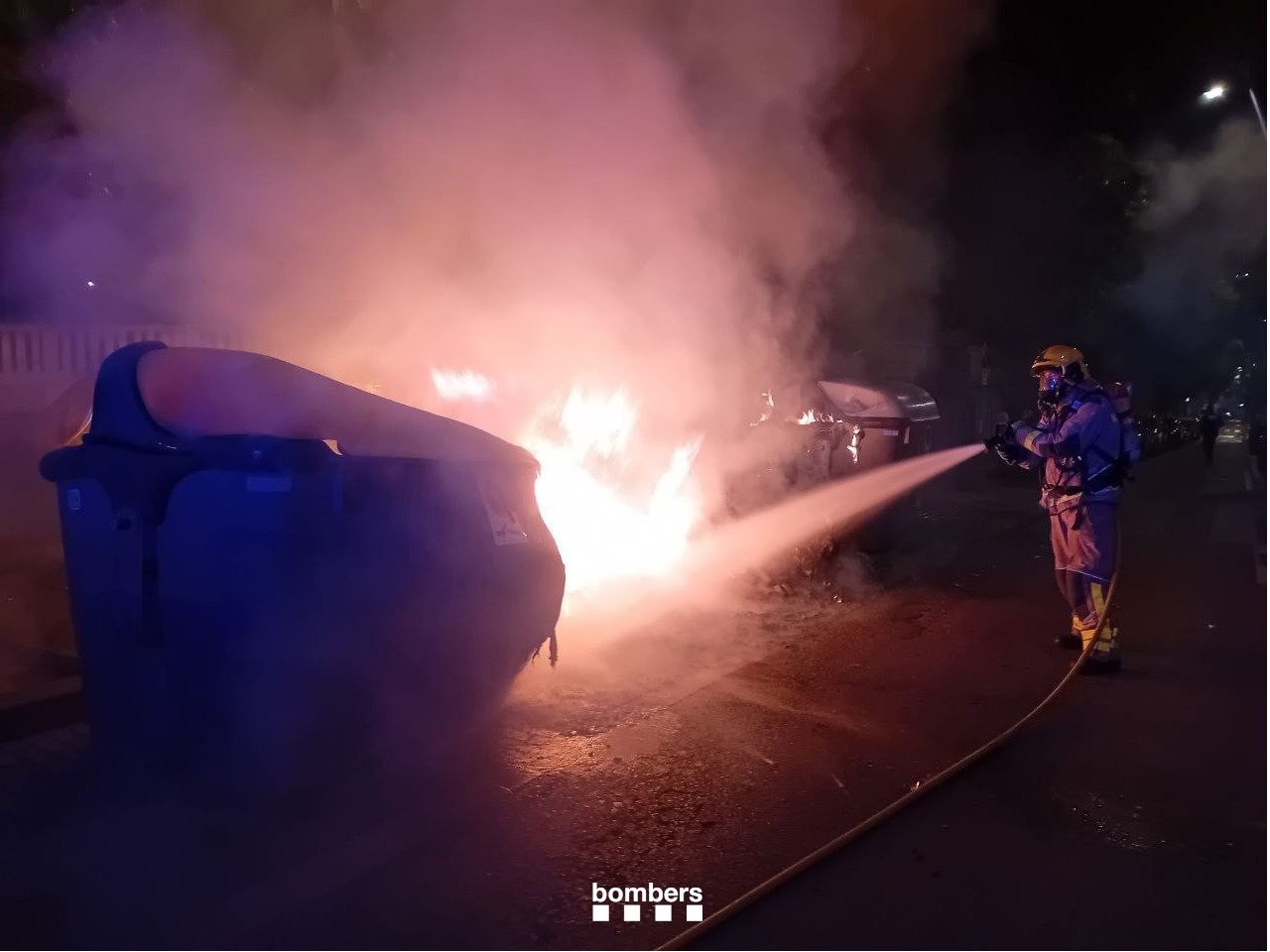 Firefighters put out a burning trash bin at Sant Joan 2025