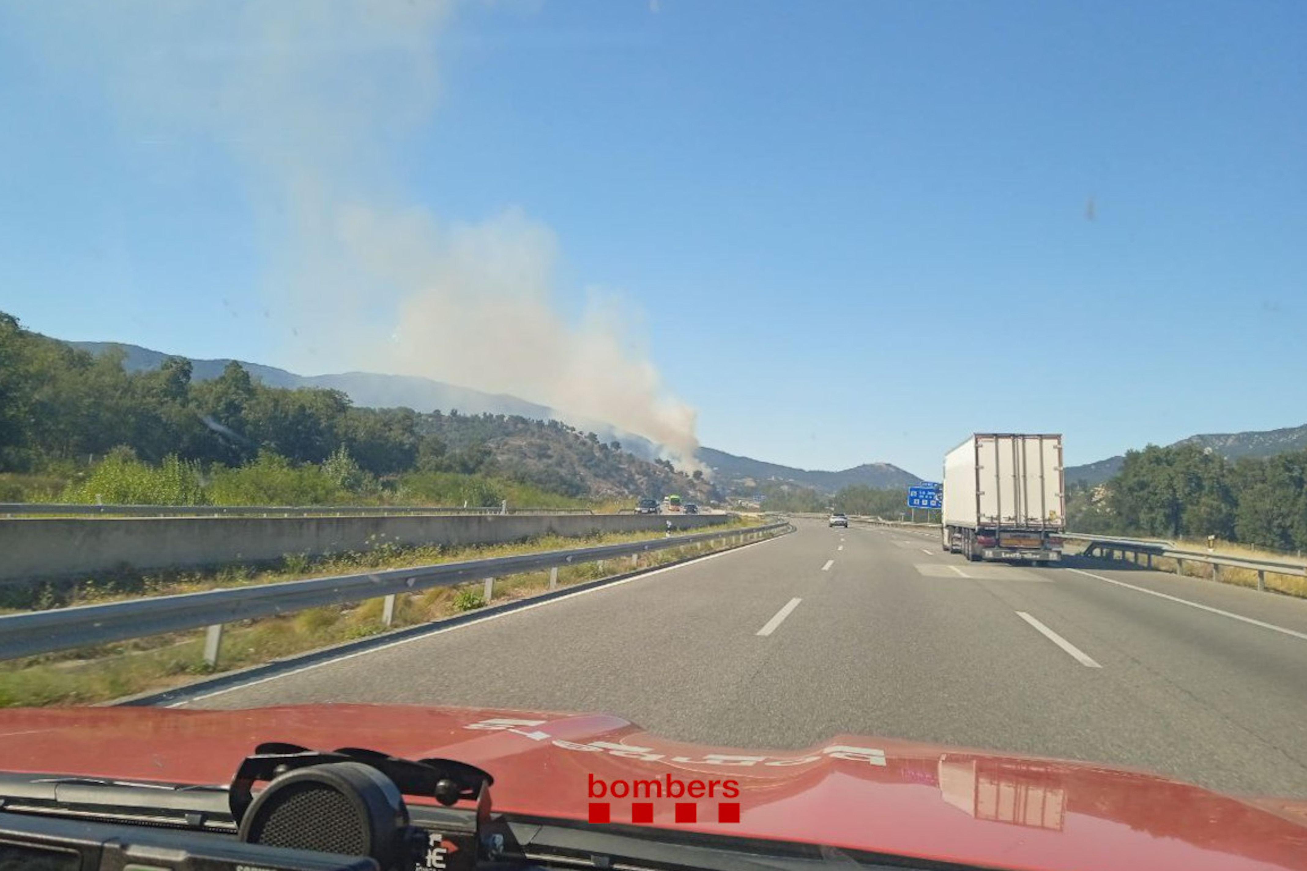 The fire burning in Agullana as seen from the road