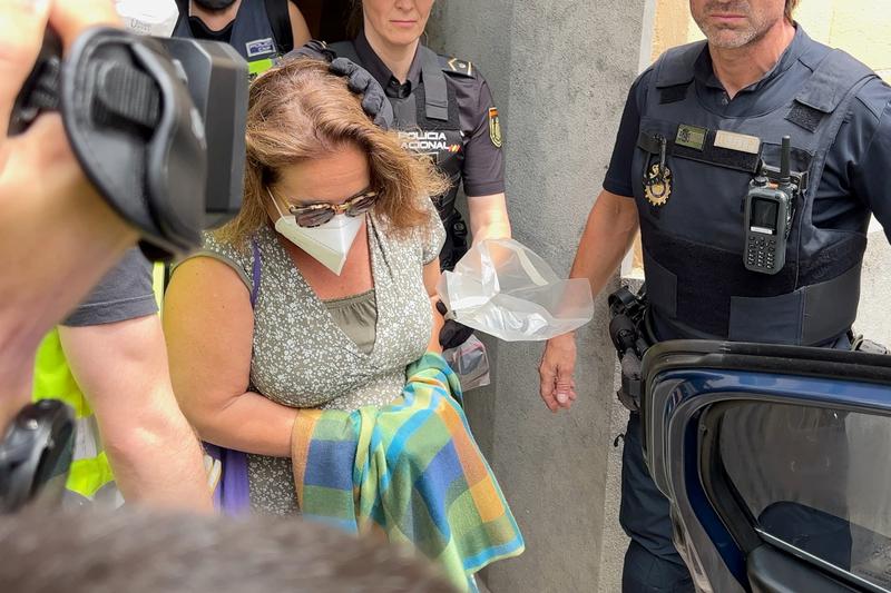 Sitges mayor Aurora Carbonell accompanied by Spanish national police leaving the city hall on June 21, 2023