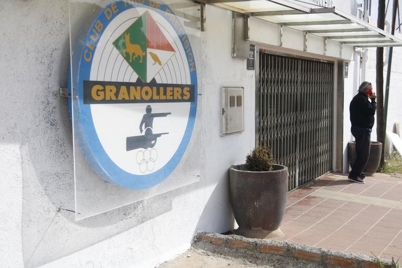 A person in front of the 'Club de Tir Precisió Granollers' in Canovelles after the shooting of the instructor on April 8, 2023