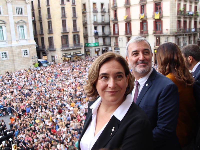 Barcelona mayor Ada Colau and deputy Jaume Collboni on the Barcelona council balcony overlooking Plaça Sant Jaume during La Mercè