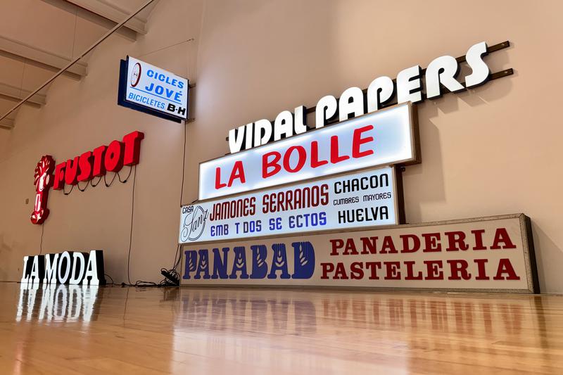 Old signs from local businesses on display in an exhibition by Patrimoni Gràfic Sabadell