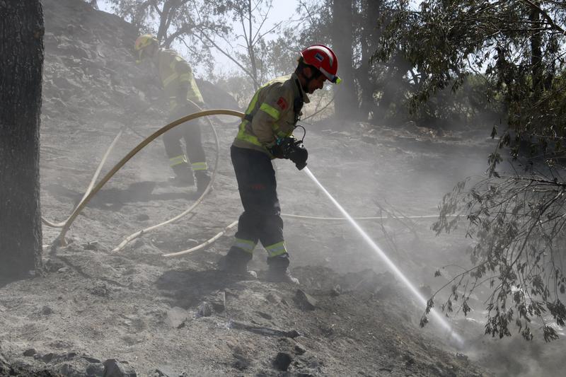 A firefighter working on the wildfire in Ciutadilla, western Catalonia, in July 2024.