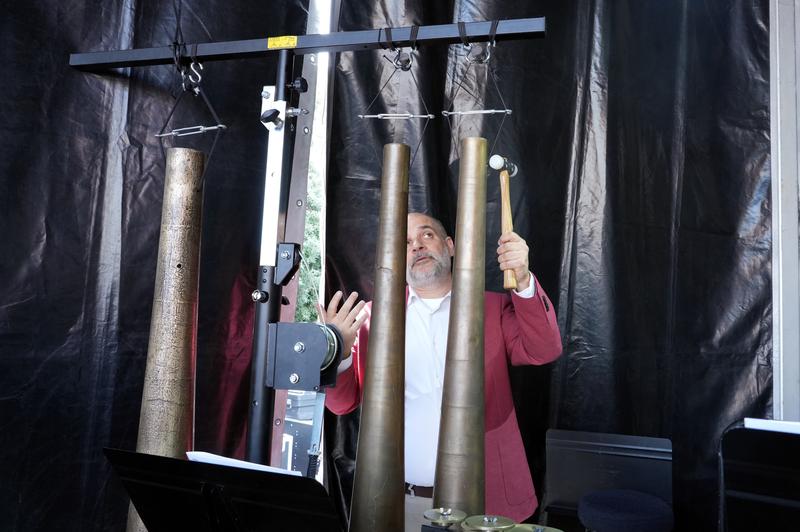 The architect, musician and director of the Gaudí Chair at the UPC, Galdric Santana, with the bells designed by Gaudí for the Sagrada Família. 
