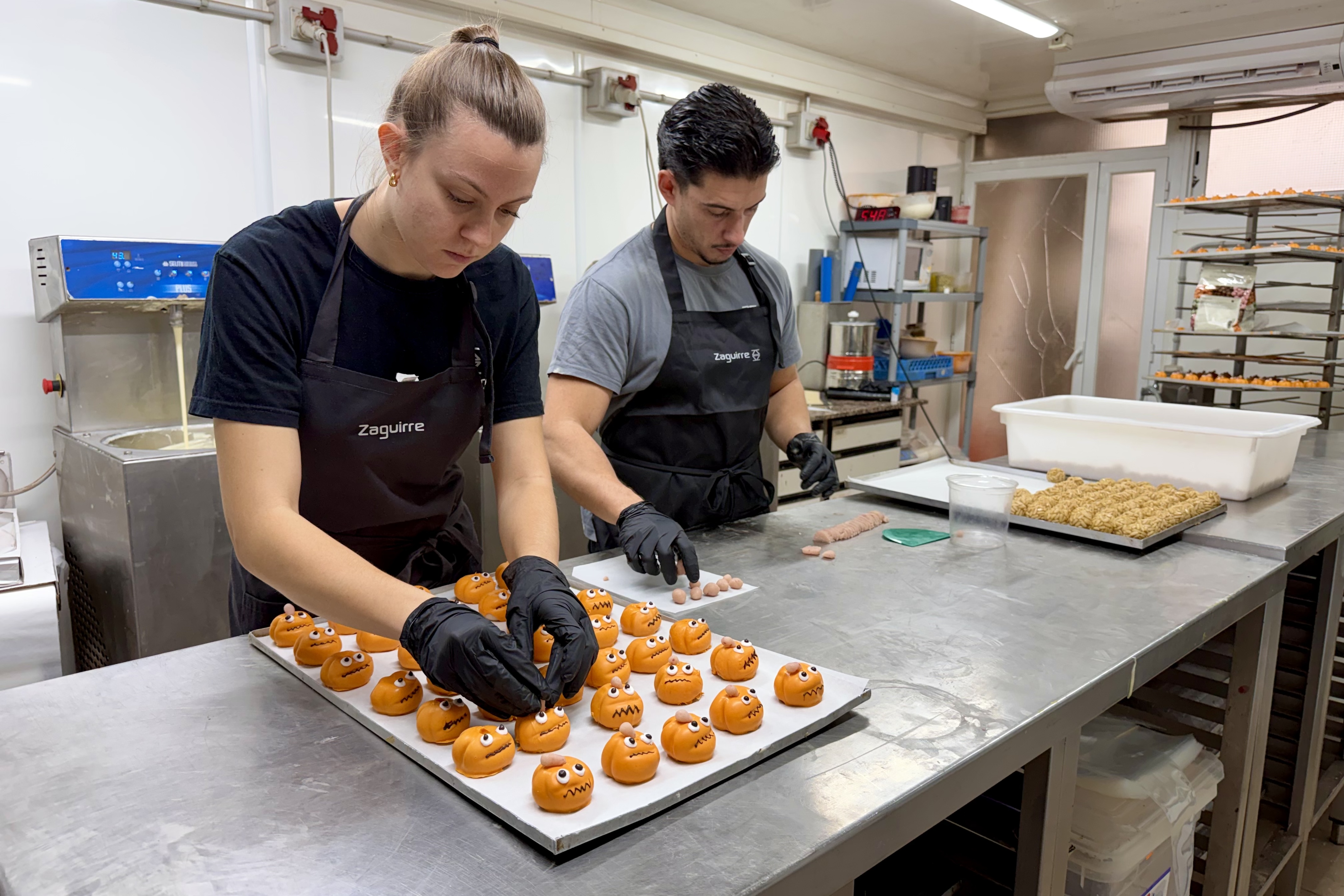 Pastry chefs making pumpkin panellets