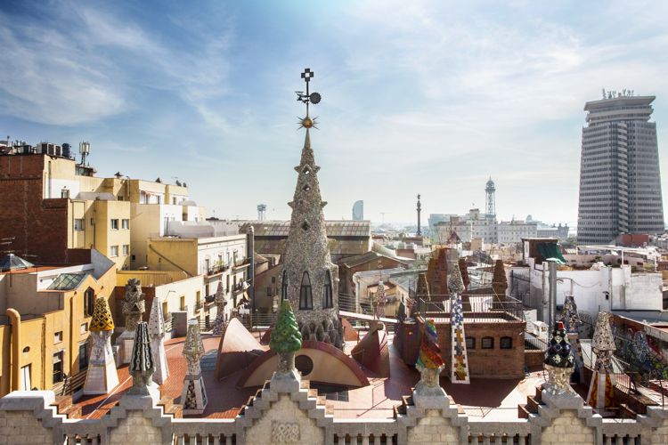 Antoni Gaudí's Palau Güell building rooftop with views to Barcelona's skyline