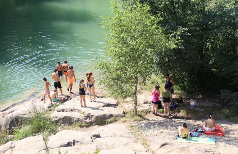 People swim in the Llobregat river in central Catalonia