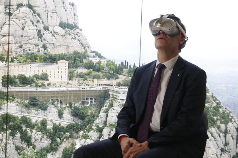 Catalan president Salvador Illa wearing VR goggles at the exhibition 'Montserrat, a Millennium: A Benedictine Contribution to the Building of Europe,' at the Palazzo della Cancelleria in Rome