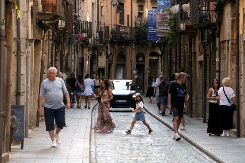 A car driving through Girona's old town