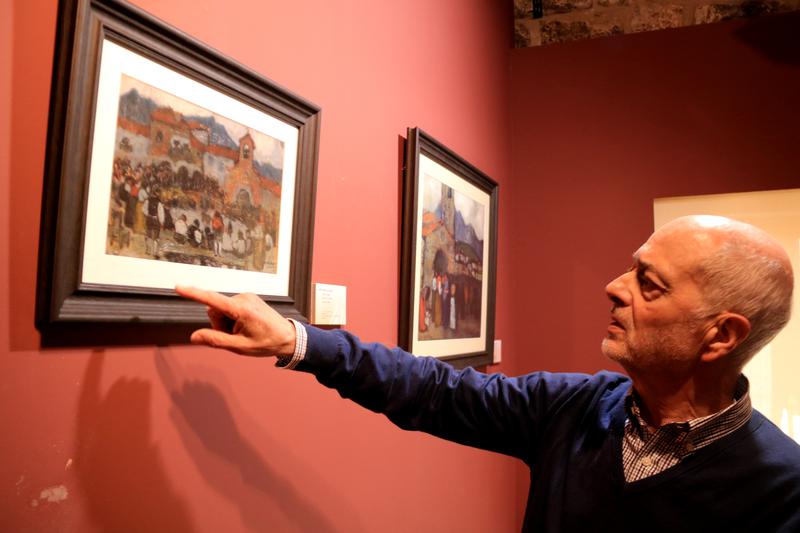 Elies Gastón, head of the Picasso Center in Horta, points to a reproduction of one of the painter's works depicting the village