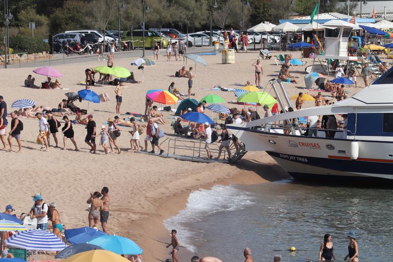 Tourists disembark from a boat in Tossa de Mar beach on September 2, 2024