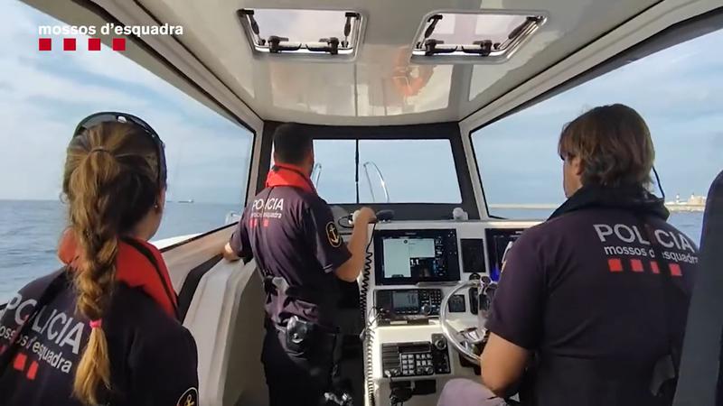 Catalan Mossos d'Esquadra police look for Levi Davis at Barcelona's port on a maritime missing person search unit