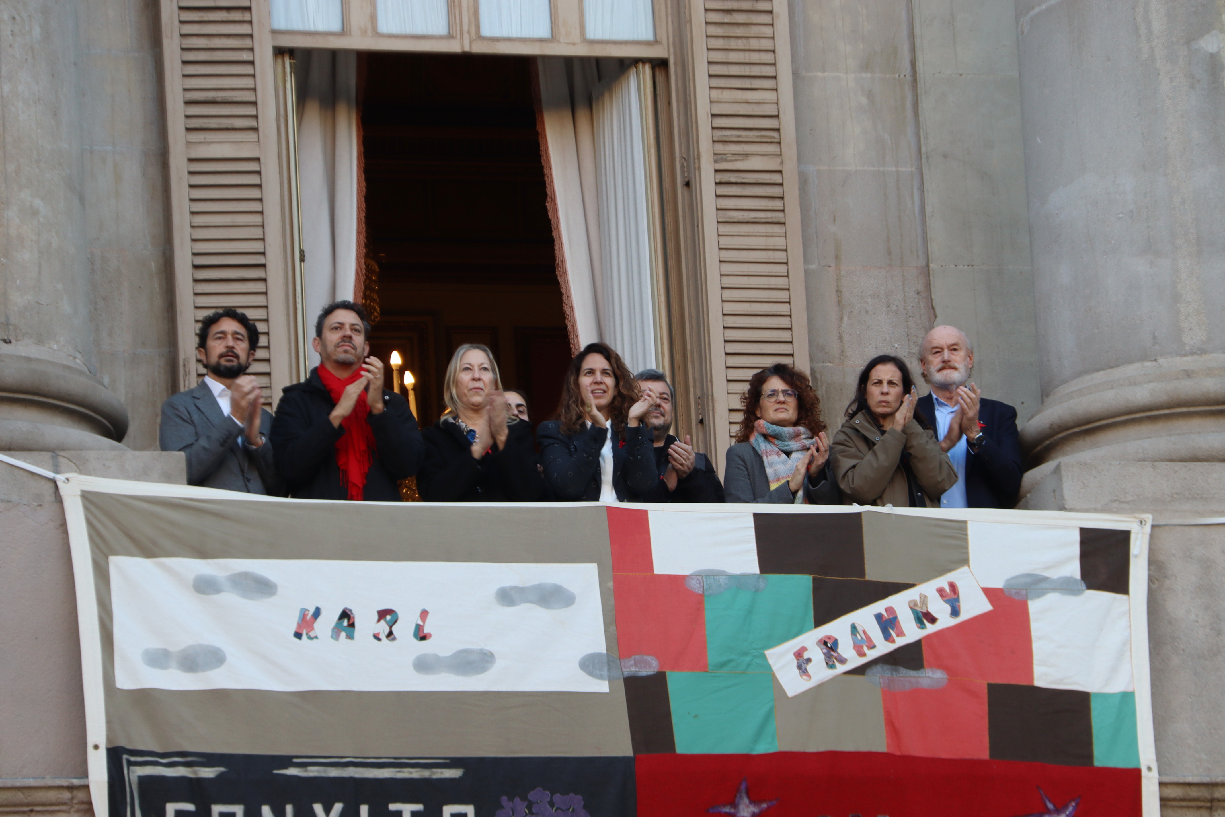 Barcelona's councillor for health, Marta Villanueva, and city council representatives unveil the AIDS Memorial Quilt at City Hall on World AIDS Day