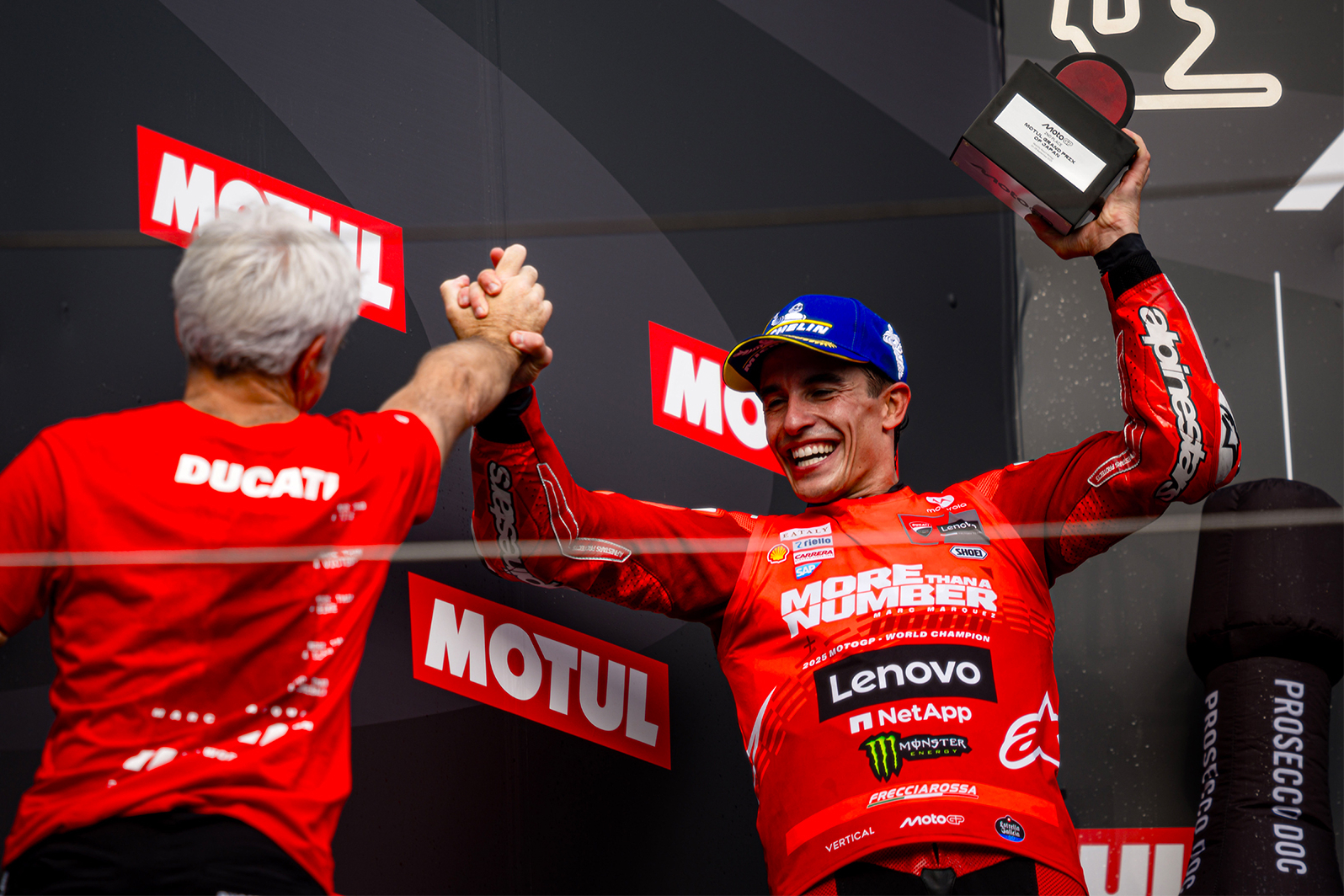 Marc Márquez celebrates on the podium of the Japan Grand Prix
