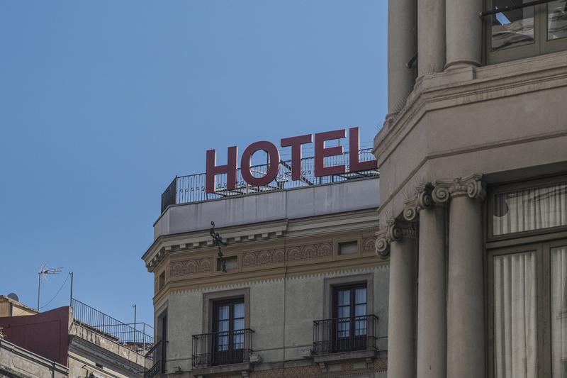 A hotel poster on top of a building in Barcelona