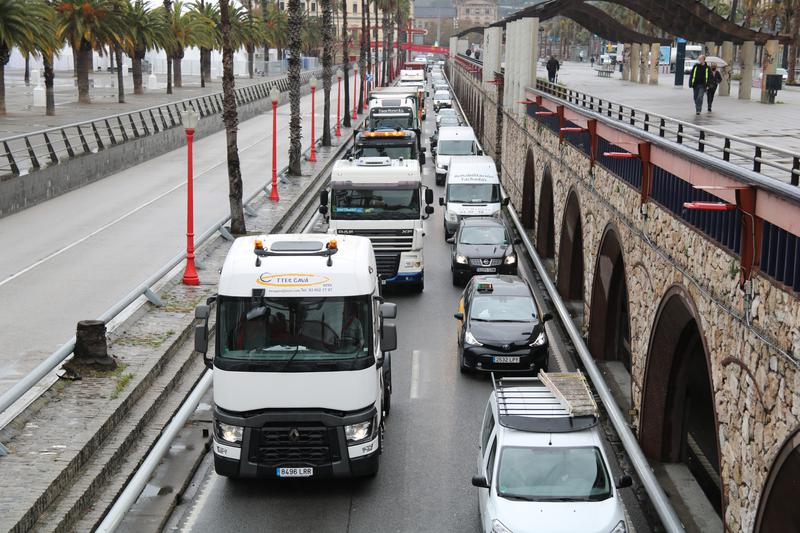 Truck drivers perform a slow drive protest in Barcelona against the rising costs of fuel