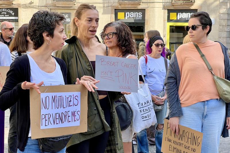 Breast cancer survivors demonstrate at Barcelona's Plaça Sant Jaume on October 19, 2024 coinciding with the International Day Against Breast Cancer