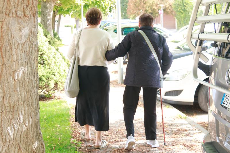 Caregiver and senior out for a walk