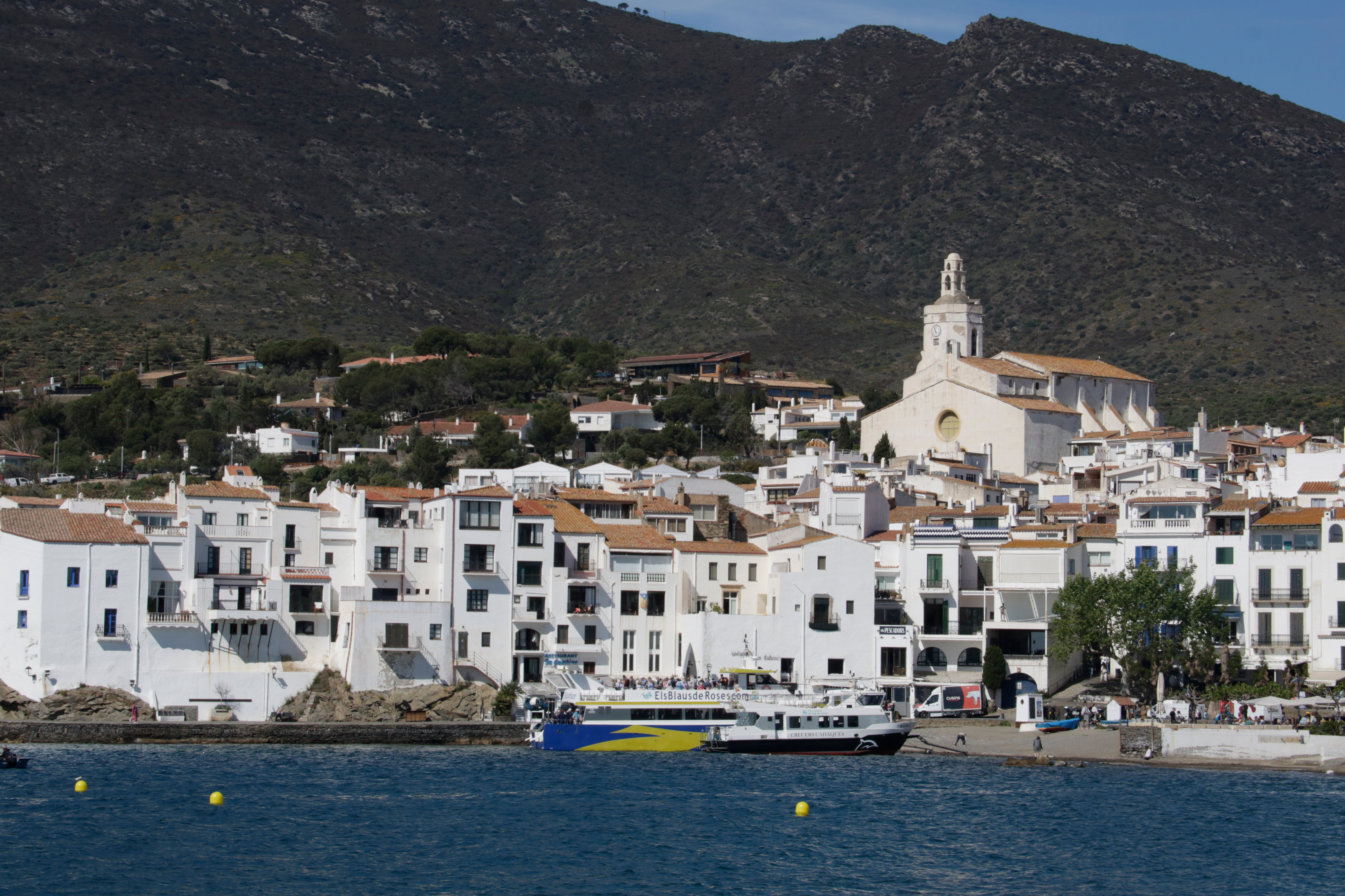 A boat docks in the coastal town of Cadaqués
