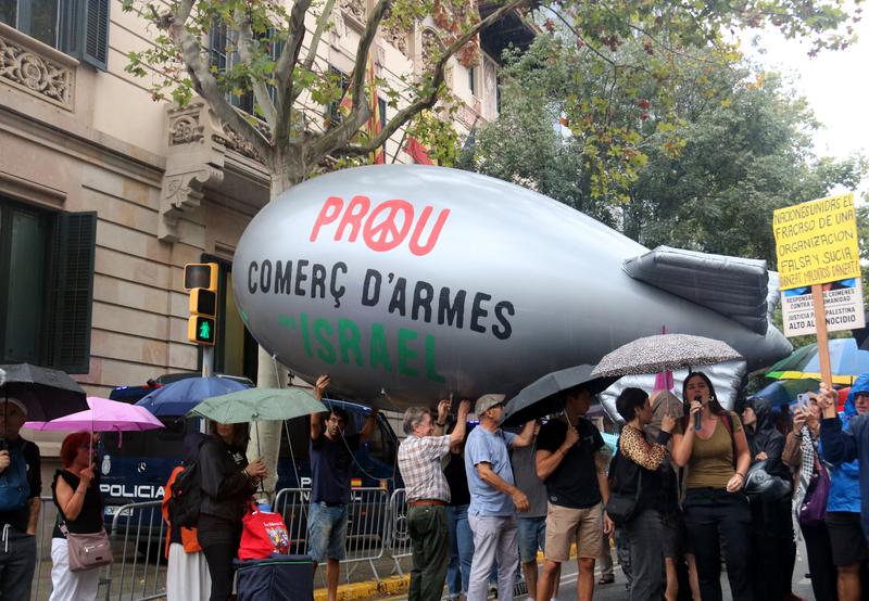 A group of protestors demonstrates against arms trade deals with Israel in Barcelona
