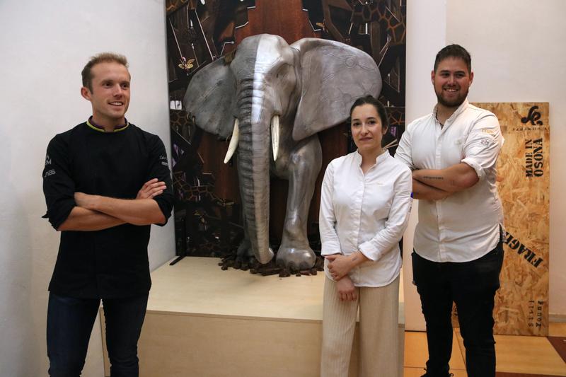 Lluc Crusellas and his team after completing the installation of his elephant figure at the Chocolate Msueum
 
