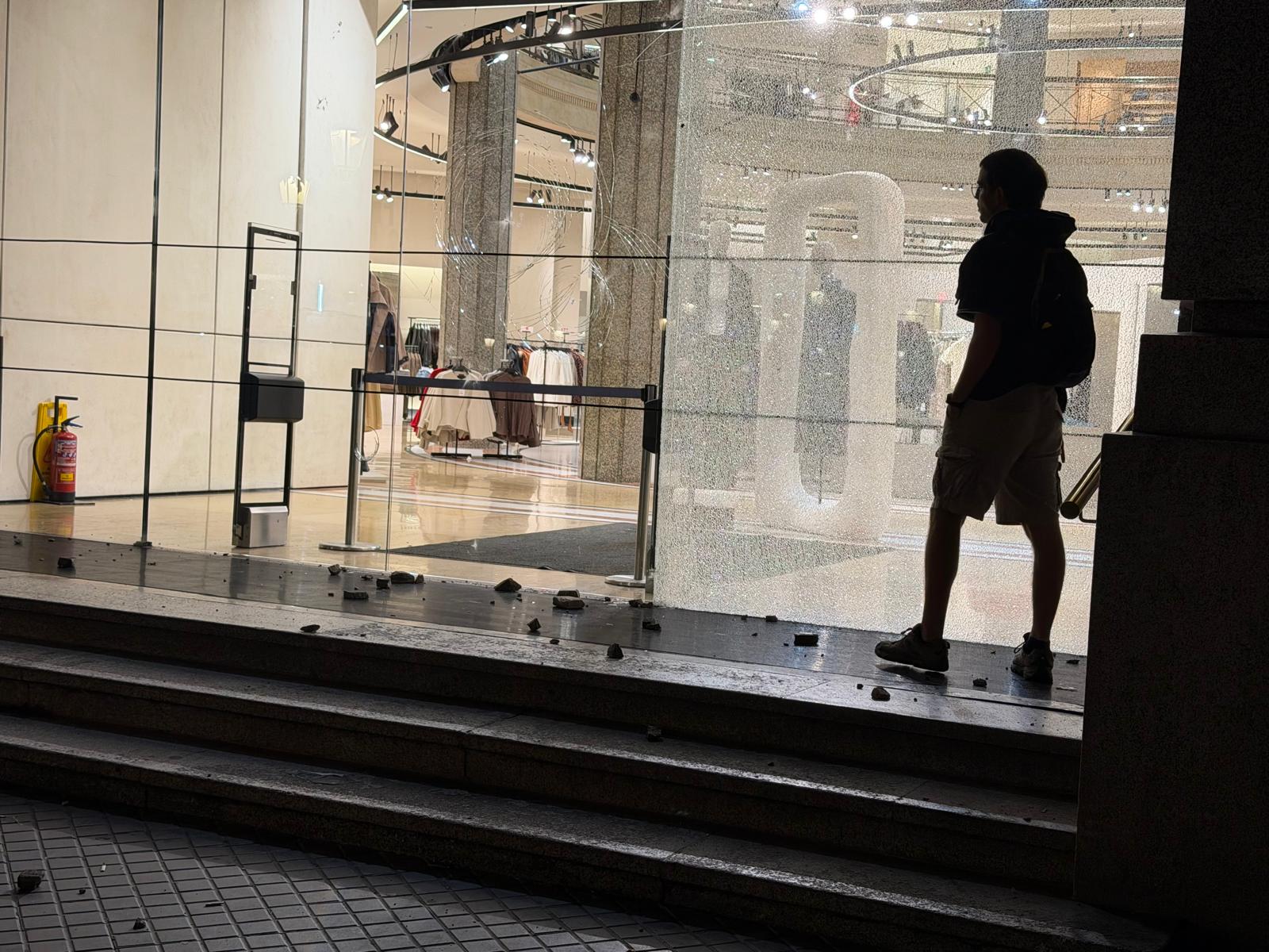 The glass doors of the Zara store by Plaça Catalunya broken
