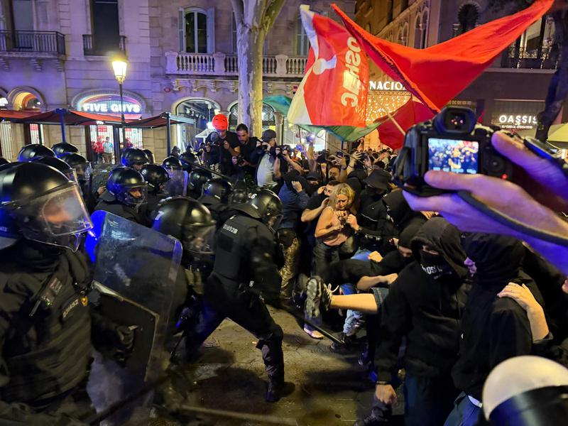 Police and housing protesters clash