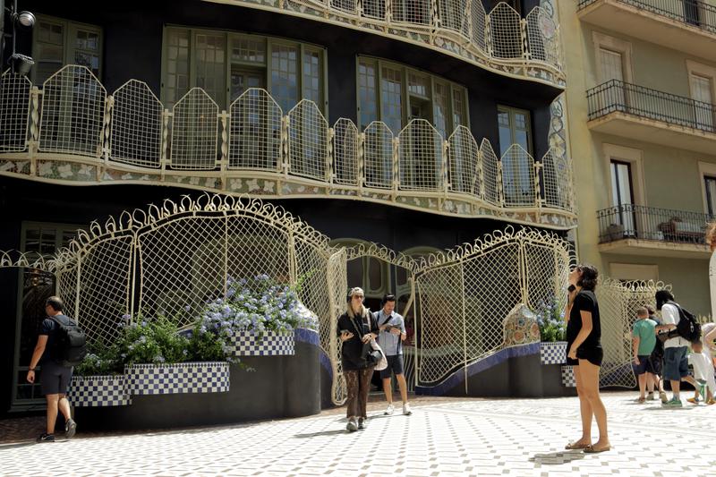 Visitors admire the restored facade of Casa Batlló in Barcelona