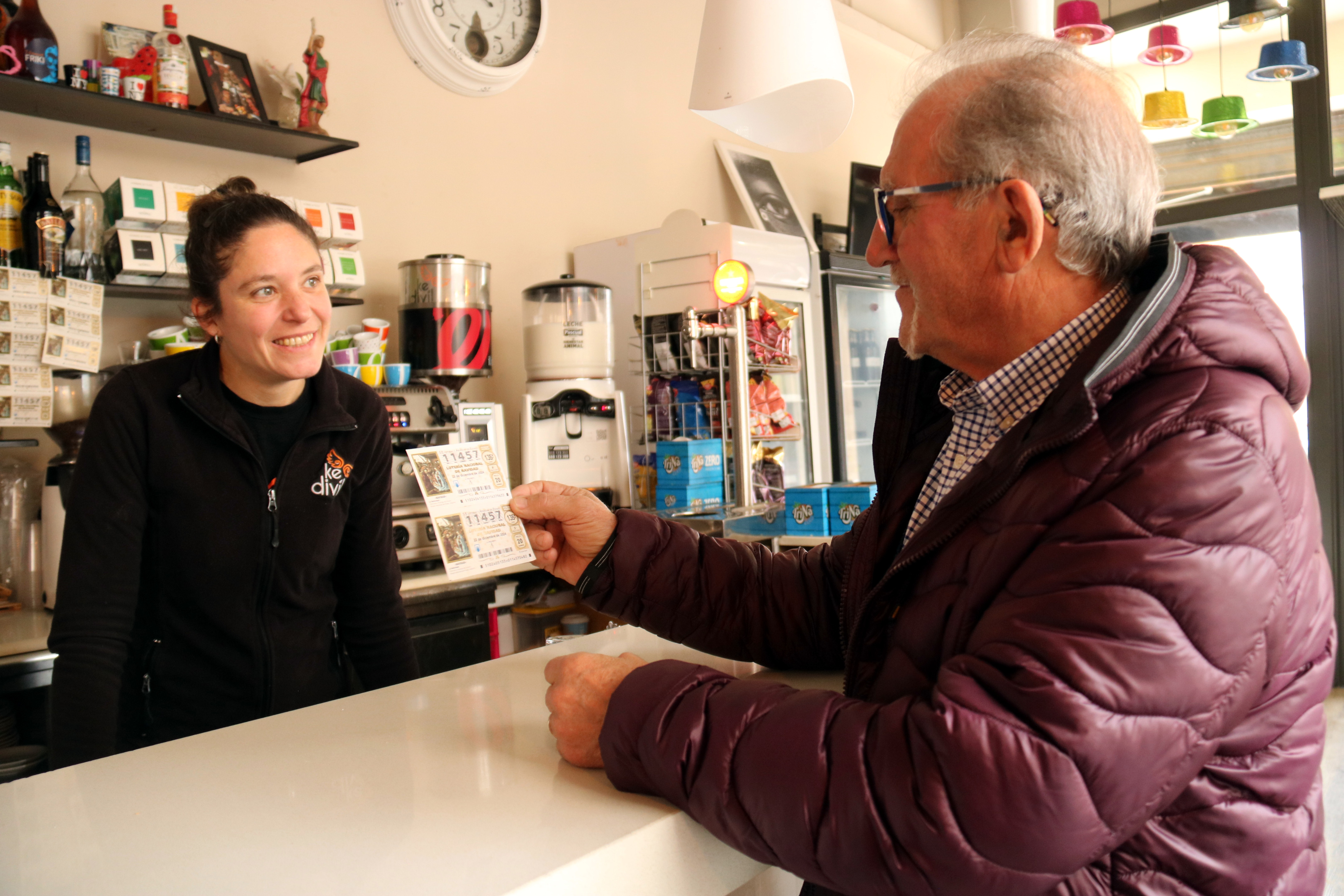 A resident of Sant Guim de Freixenet buys the a 'décimoo' of Spain's Christmas lottery with the number 11457