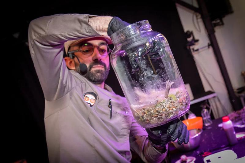 A person displays products at FRMNT Festival 2025