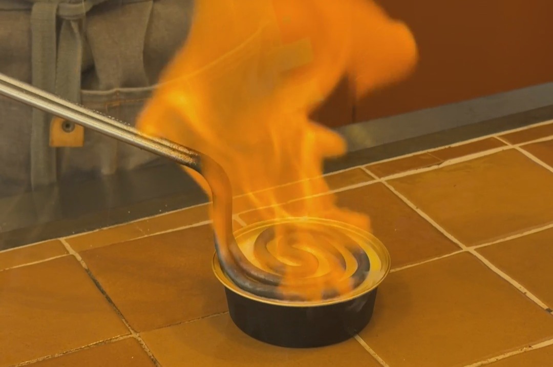 The crema catalana is caramelized on the spot using a hot iron paddle