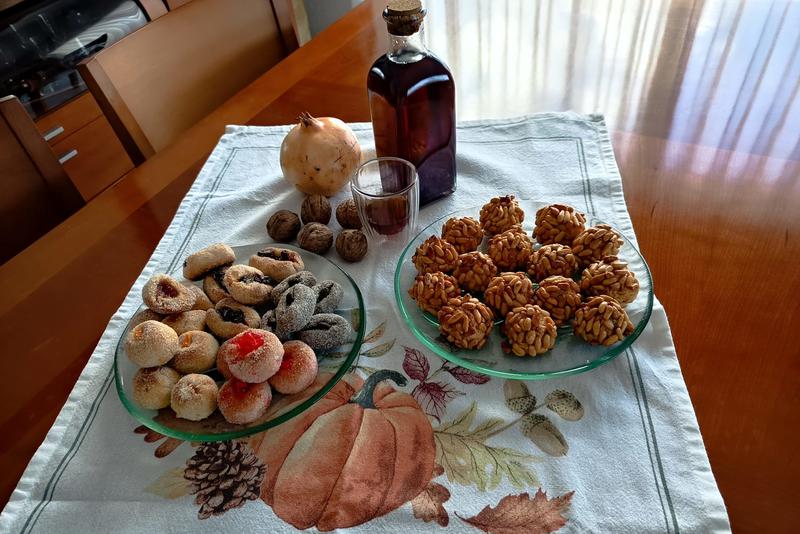 Several home-made panellets with a bottle of Moscatell before the Castanyada festivities