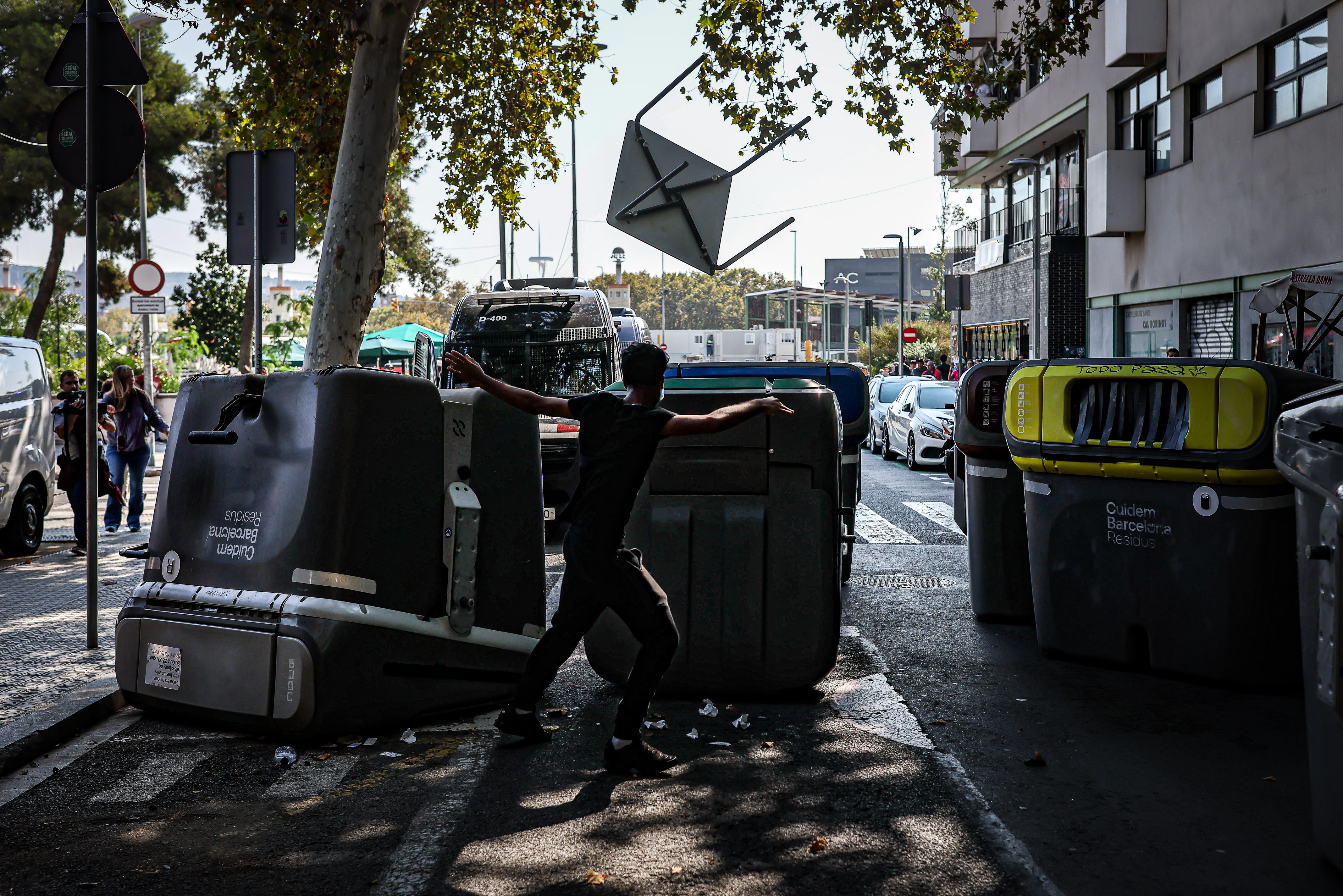 Containers block access to Mossos d'Esquadra police during a pro-Palestine demonstration in Barcelona on October 15, 2025
