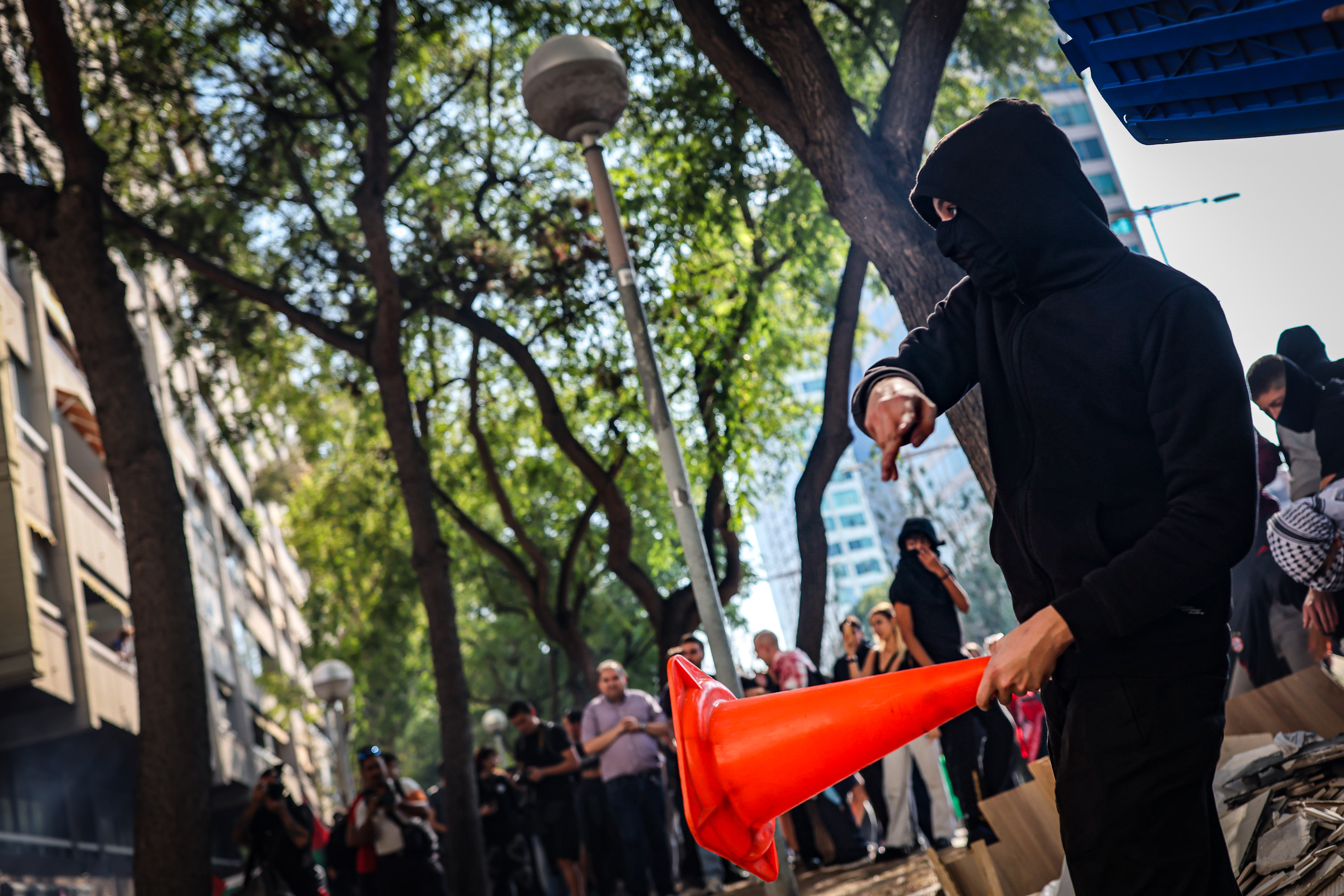 A hooded demonstrator during the pro-Palestine protest in Barcelona