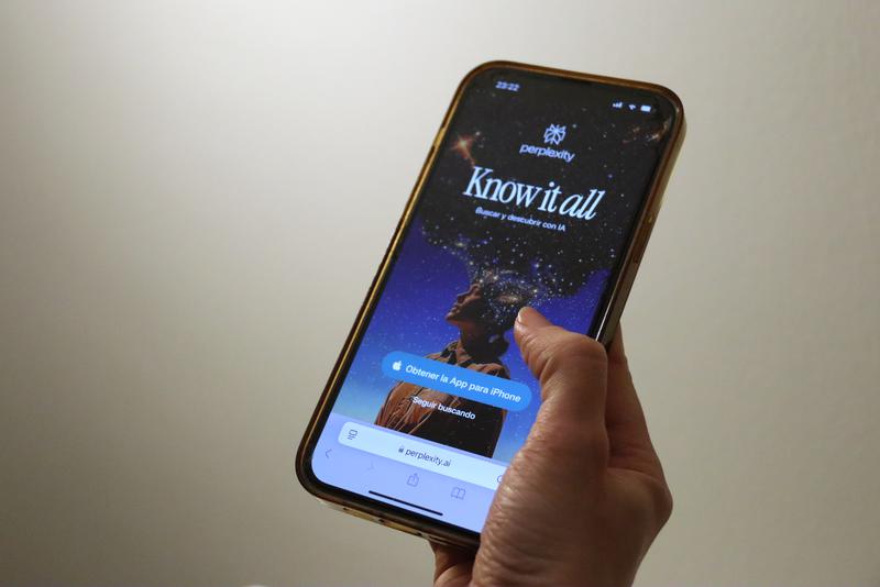 A phone showing the website of Perplexity AI