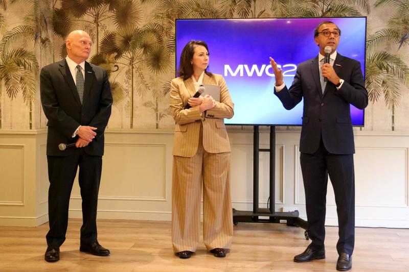 GSMA CEO John Hoffman, GSMA Chief Marketing Officer Lara Dewar, and VEON CEO Vivek Badrinath speaking at a presentation event for MWC 2026