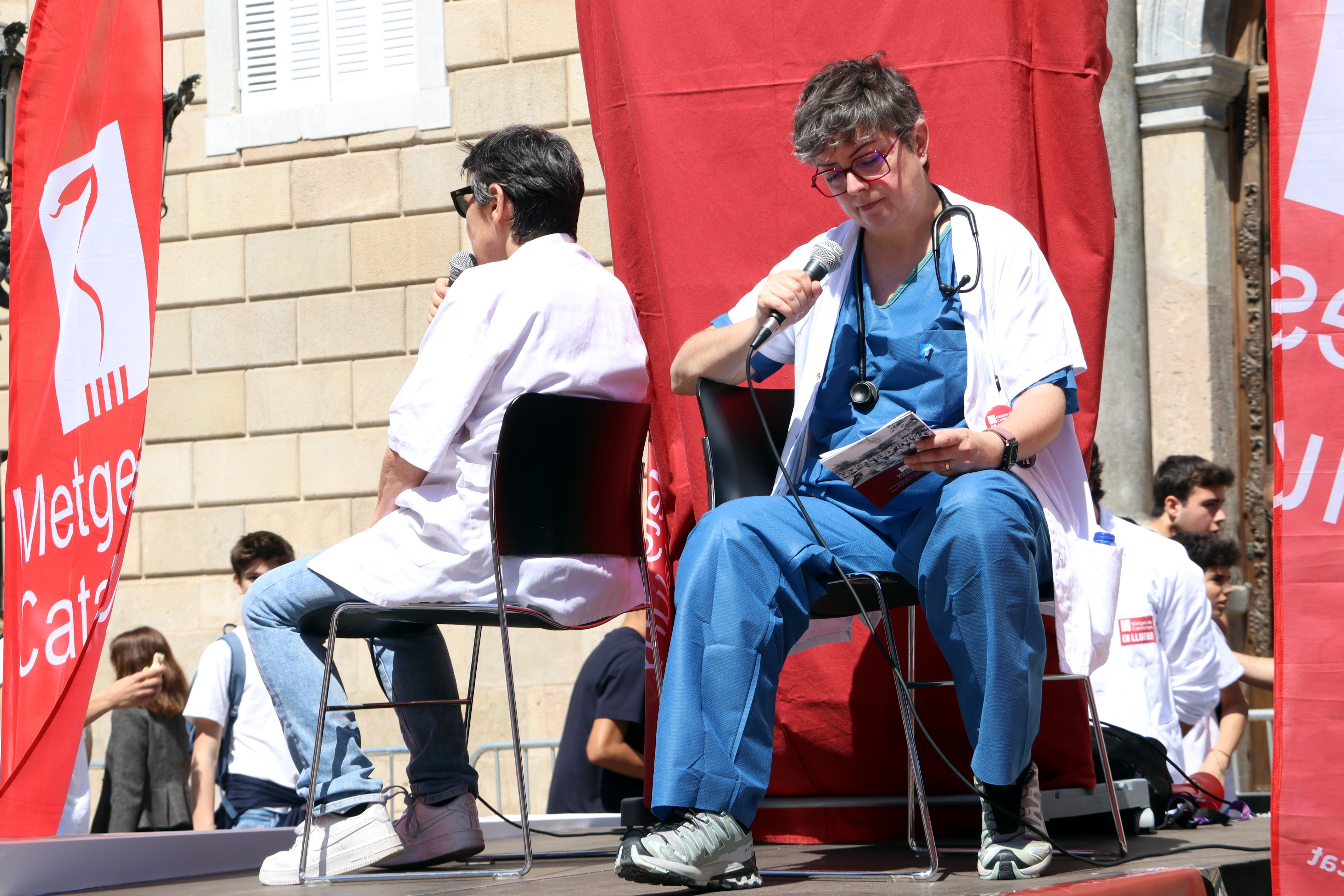 Doctors recreate the 'confession box', as seen during Rosalía concerts during her 'Lux' tour, as part of their protest