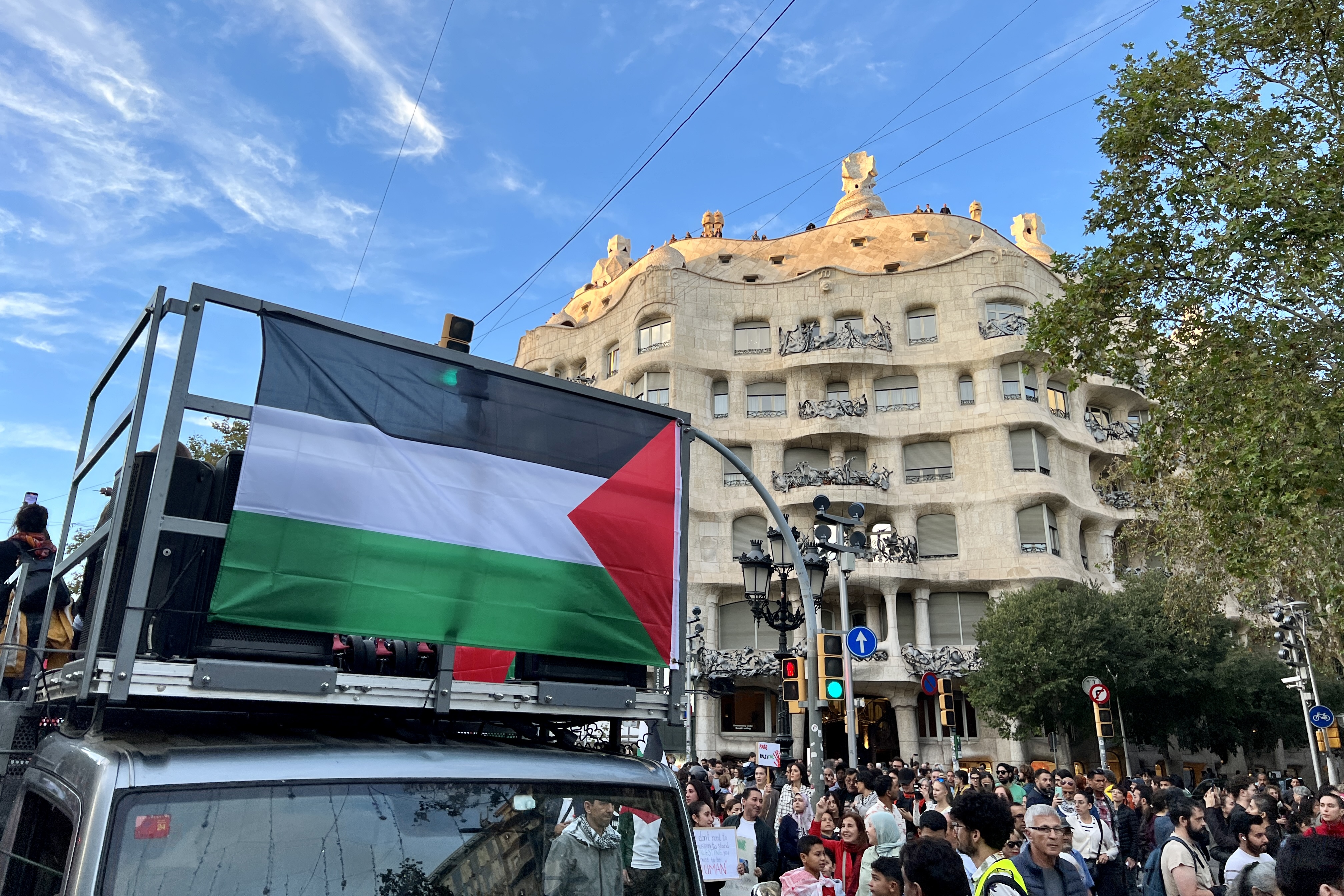 Antoni Gaudí’s La Pedrera building with a Palestinian flag in front during a demonstration against the war in Palestine on October 21, 2023