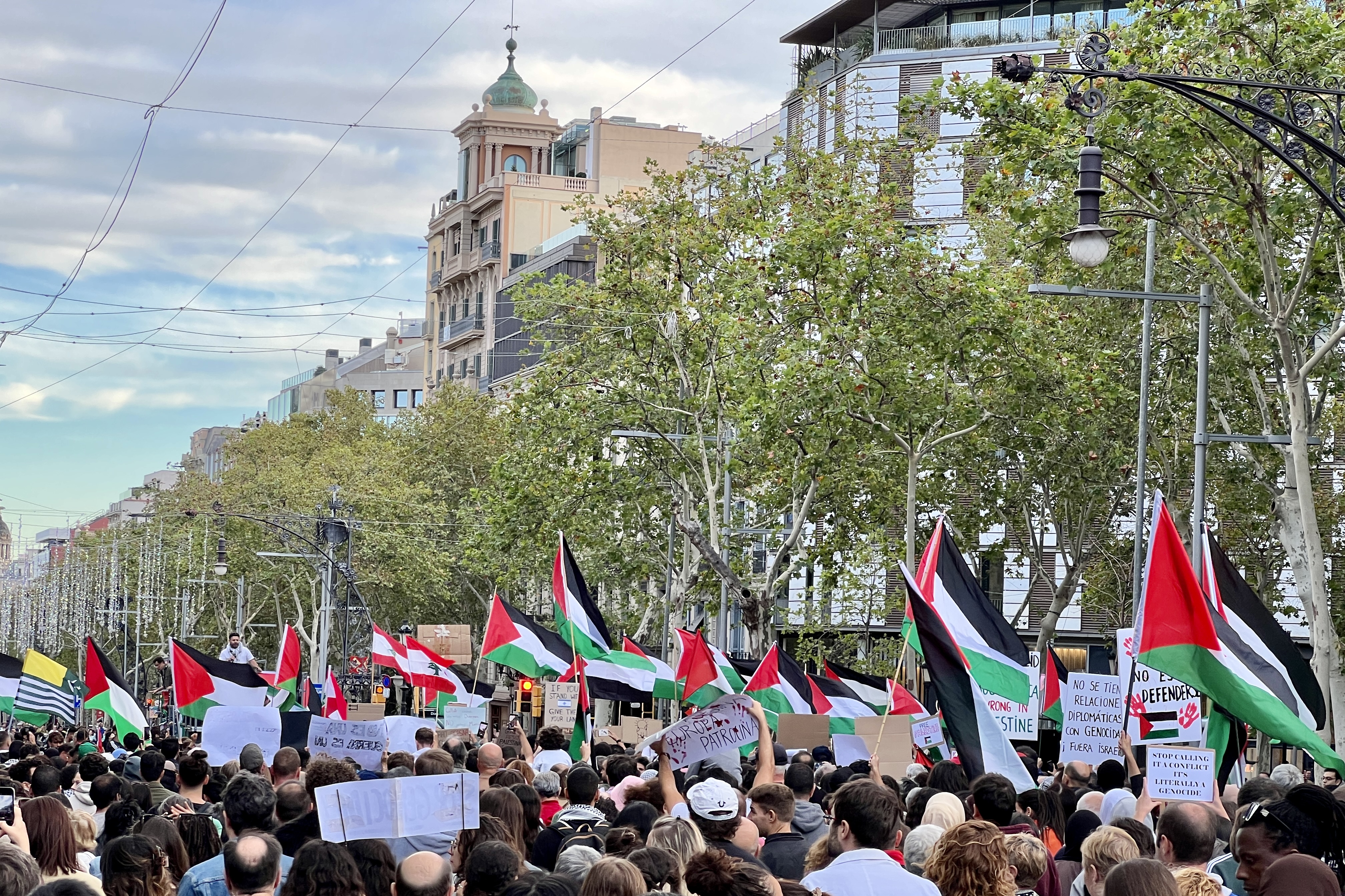Palestinian flags waiving during a demonstration on Barcelona’s Passeig de Gràcia boulevard on October 21, 2023