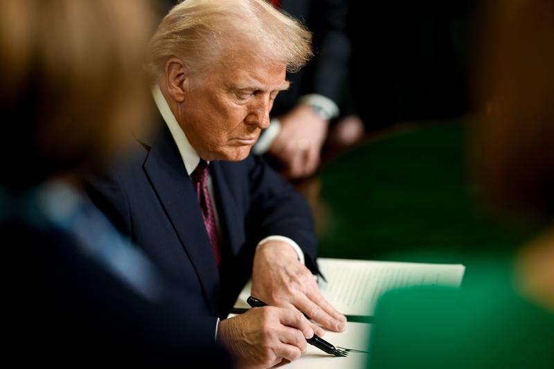 Donald Trump signing the first executive orders as the 47th president of the United States