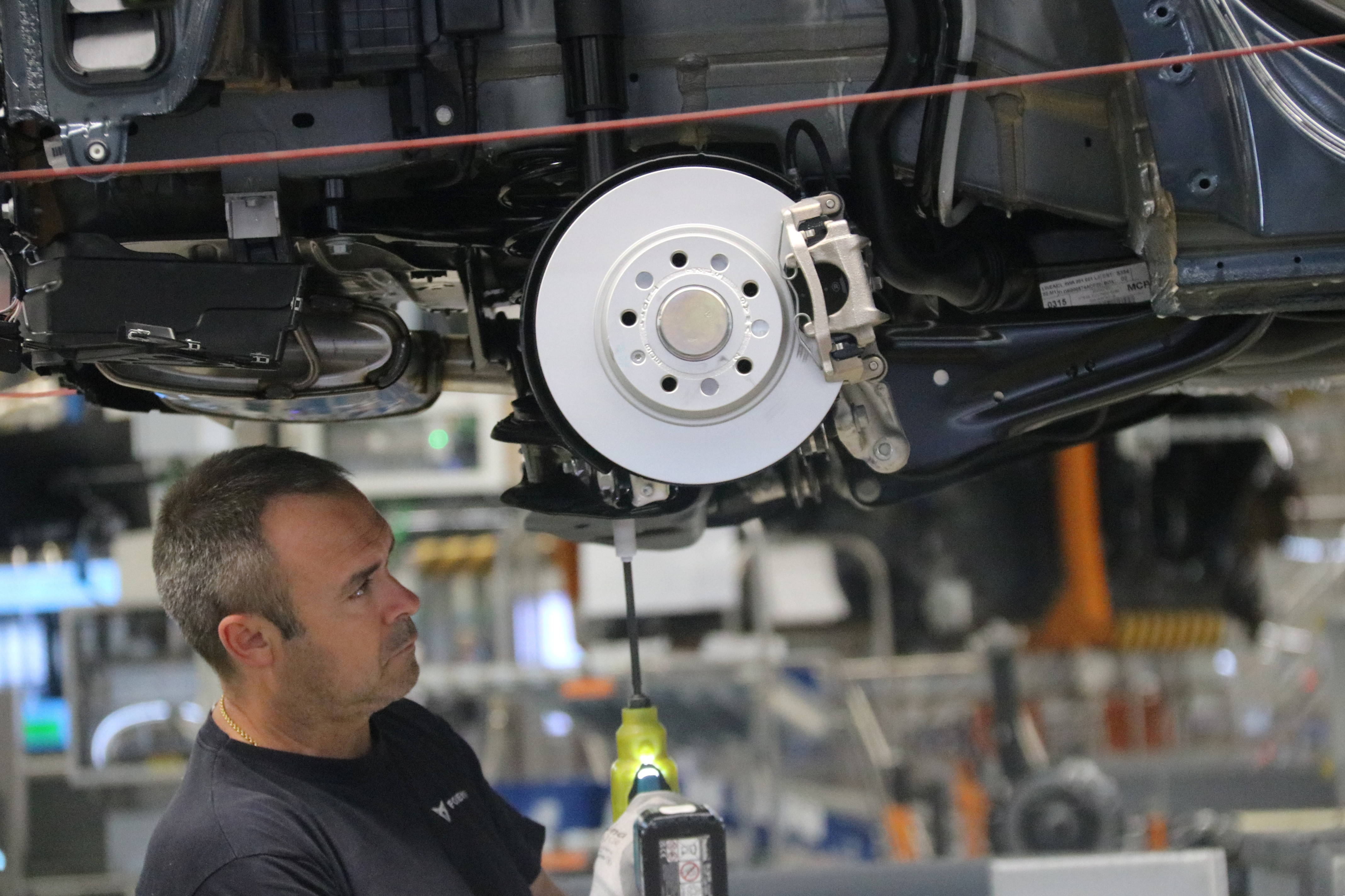 A worker on the car assembly line at the Seat-Cupra plant in Martorell