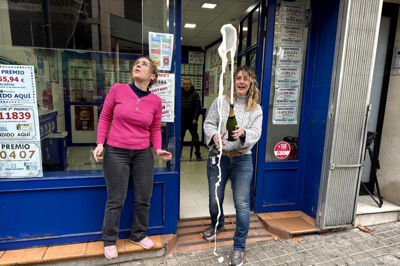 The owner of the 35 lottery store in Badalona celebrates selling part of the 4th prize of Spain's Christmas lottery on December 22, 2025