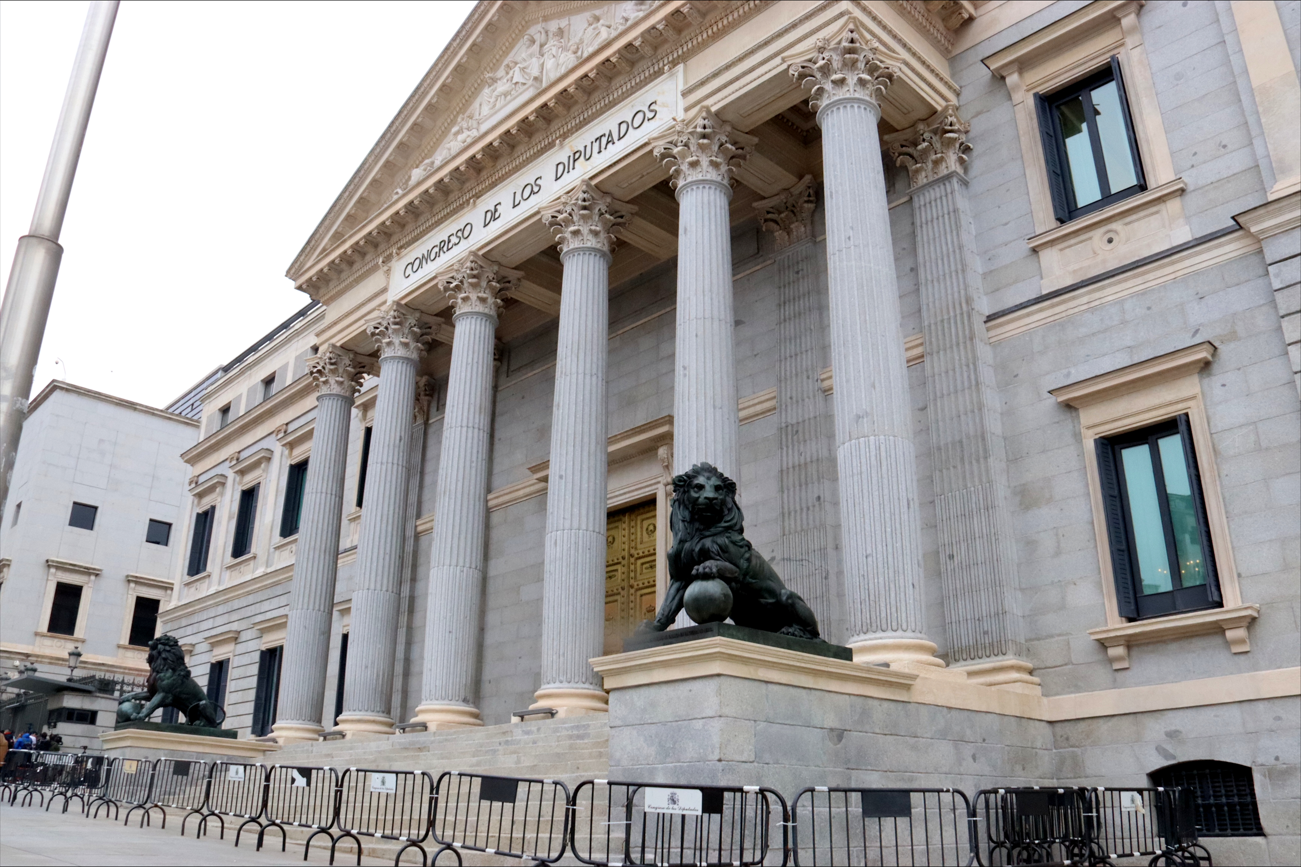Spain's Congress façade with two statues representing lions on each side of the main door