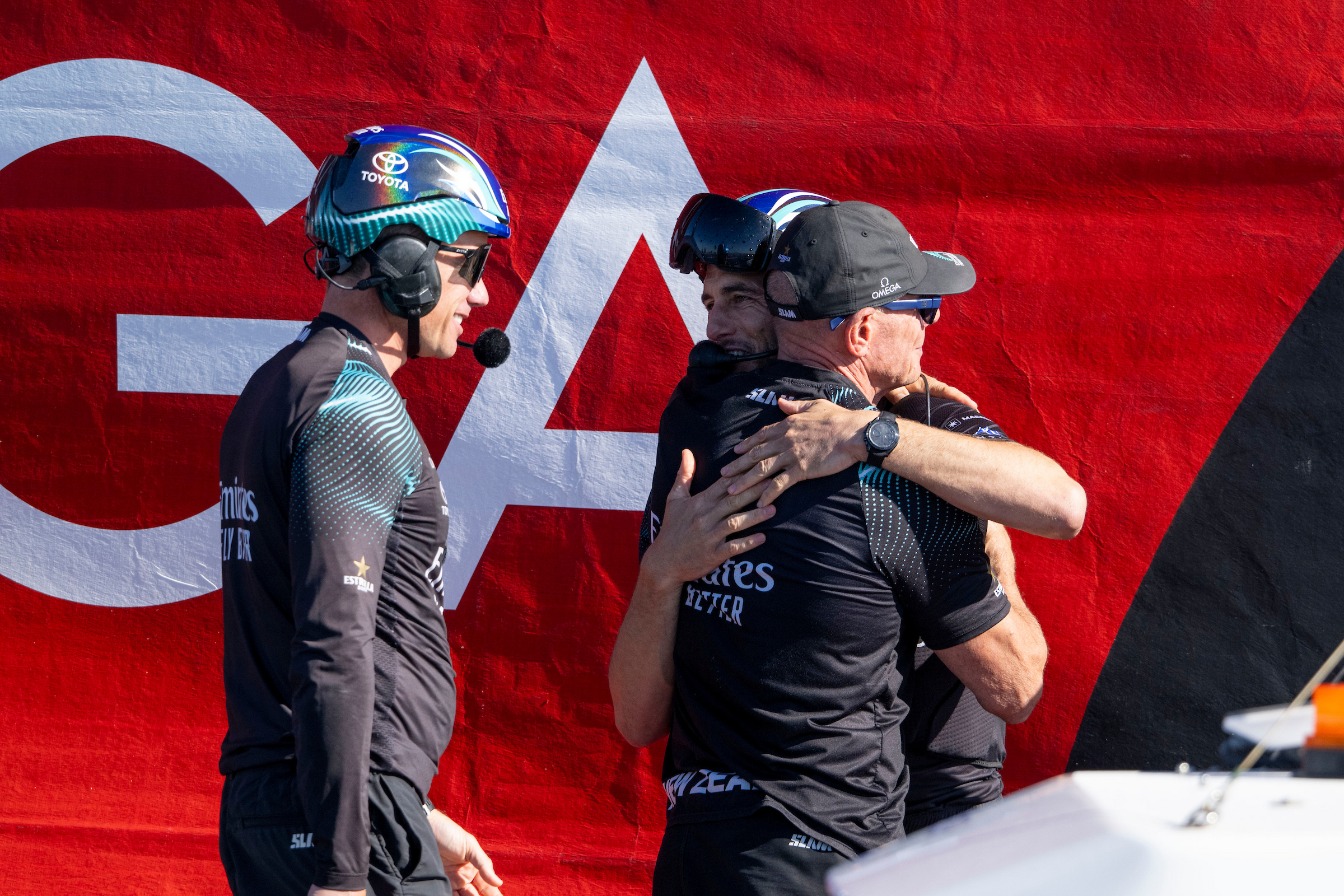 America's Cup CEO Grant Dalton hugs with his team after the victory of the Emirates Team New Zealand during the Match on October 19, 2024