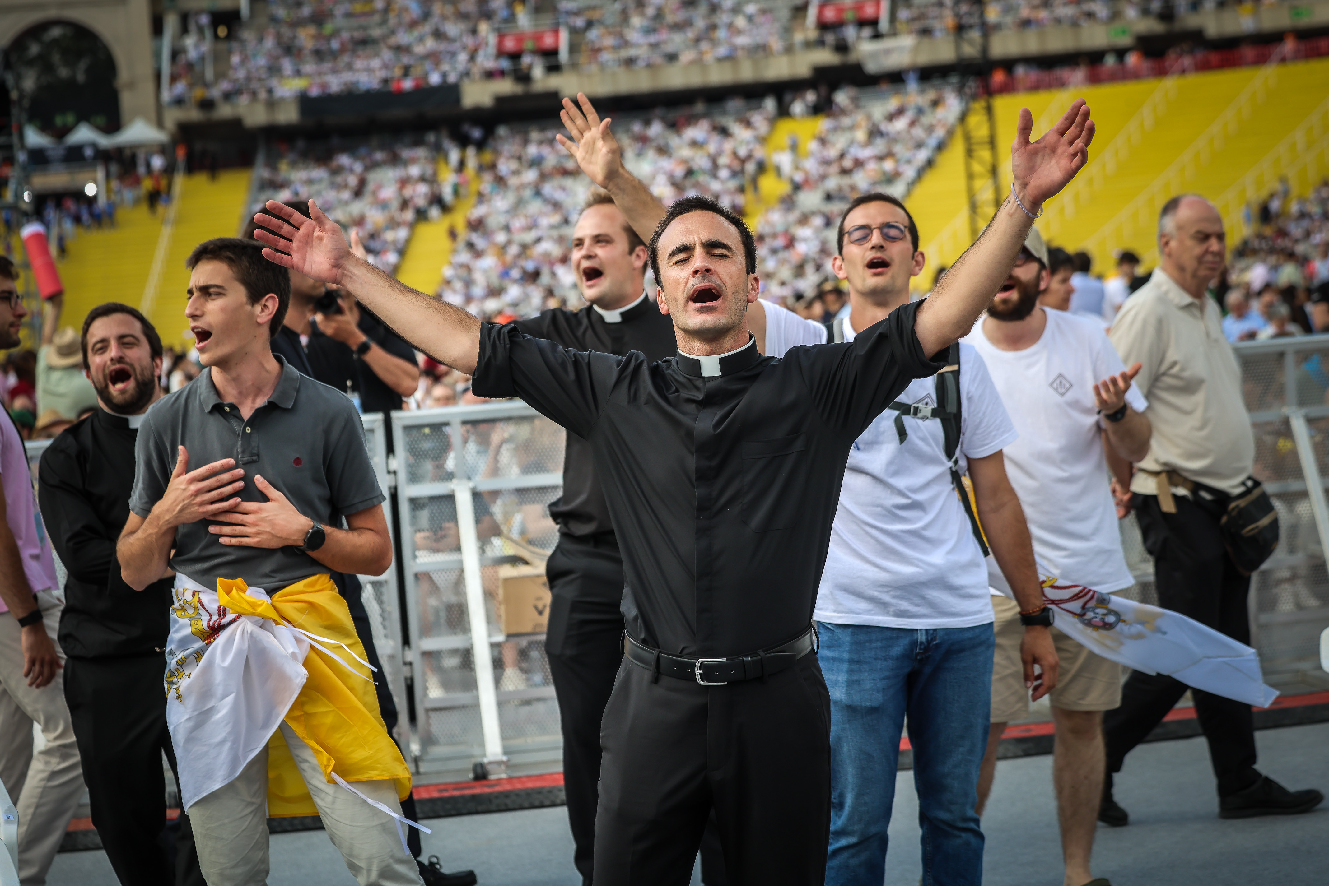 Audience members at the Olympic Stadium enjoy the musical performances