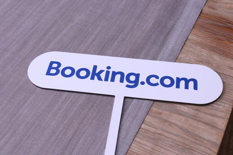 A poster with the Booking.com logo